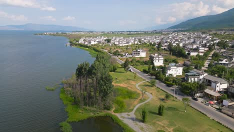 Drone-footage-of-a-small-village-next-to-Er-Hai-in-Dali,-Yunnan,-China