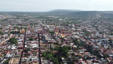 San-miguel-de-allende,-showcasing-colorful-buildings-and-historic-church-,-aerial-view