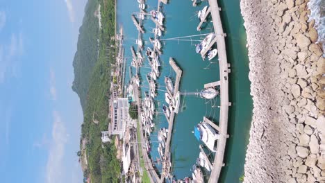 Vertical-aerial-view-of-boats-moored-at-harbour-of-Marina-Ocean-World-in-Puerto-Plata-Dominican-Republic