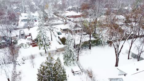 Snow-storm,-aerial-Canadian-neighbourhood-covered-in-thick-snow,-Longueuil