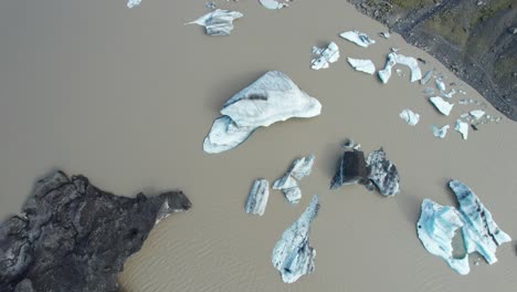 Aerial-view-of-icebergs-floating-in-a-glacier-lake-in-Iceland-during-summer