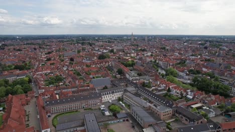 Aerial-shot-of-Bruges-in-Belgium-overlooking-the-city-center-and-it's-churches