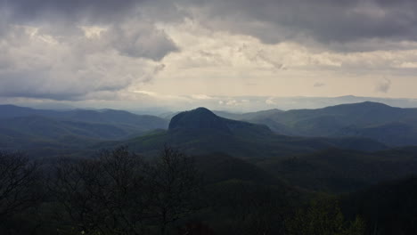 Moving-through-trees-towards-Looking-Glass-Rock-in-North-Carolina-mountains