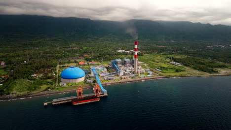 Coal-power-plant-on-Bali-North-Coast-with-smokestack-emitting-gases,-aerial