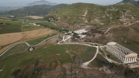 Aerial-drone-fly-above-Archaeological-Park-of-Segesta-ruins-in-Sicily-,-Italy-old-ancient-historical-ruins