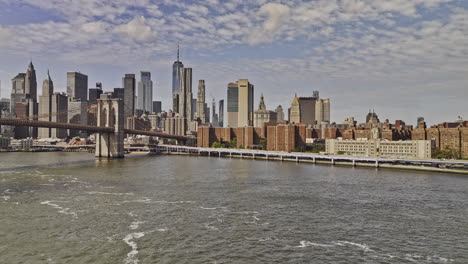 NYC-New-York-Aerial-v401-drone-flyover-East-river-across-Two-bridges-neighborhood-towards-Financial-district-capturing-cityscape-of-Lower-Manhattan-views---Shot-with-Mavic-3-Pro-Cine---September-2023