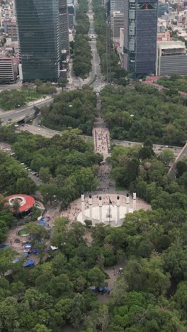 Aerial-view-of-Chapultepec-Park-revealing-Paseo-de-la-Reforma-in-Mexico-City,-vertical-mode