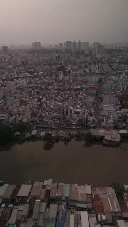 Urban-density-along-canal-in-poor-area-of-Ho-Chi-Minh-City,-Vietnam