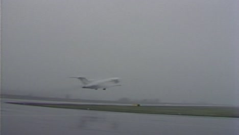 1970S-WESTERN-AIRLINES-AIRPLANE-TAKING-OFF-IN-BAD-WEATHER