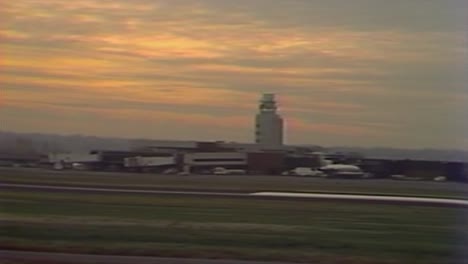 1970S-UNITED-AIRLINE-AIRPLANE-TAXING-ON-RUNWAY-AT-AIRPORT