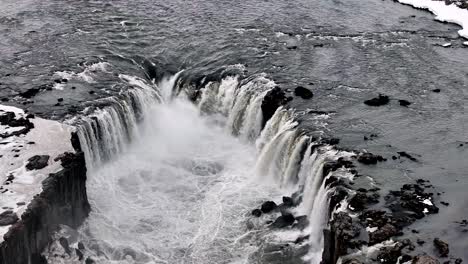 Orbiting-drone-shot-above-Selfoss-Waterfall,-Iceland