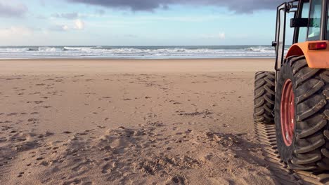 static-view-of-the-seashore-with-a-tractor-wheel-in-the-foreground