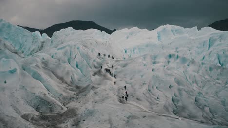 Tourists-Hiking-On-Top-Of-The-Perito-Moreno-Glacier-In-Patagonia,-Argentina---Wide-Shot