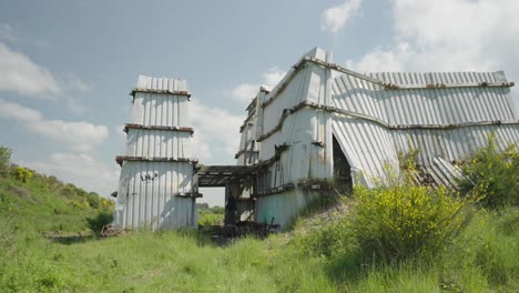 Strange-shadowy-figure-emerges,-dark-structure,-creepy,-broken-building