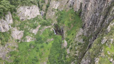 landscape-shot-of-waterfall-in-the-middle-of-rocky-mountains-caucasian-mountains