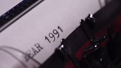 Year-1991,-Typing-on-Blank-White-Paper-in-Vintage-Typewriter,-Close-Up