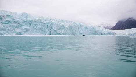 Glacier-and-Cold-Arctic-Sea,-Coast-of-Greenland-on-Misty-Day