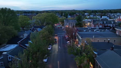Traffic-on-main-street-of-historic-town-at-dusk