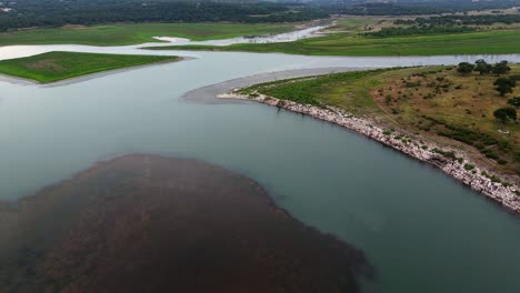 High-smooth-motion-aerial-shot-showcasing-the-calm-water-of-Canyon-Lake-and-Texas-hill-country-landscape