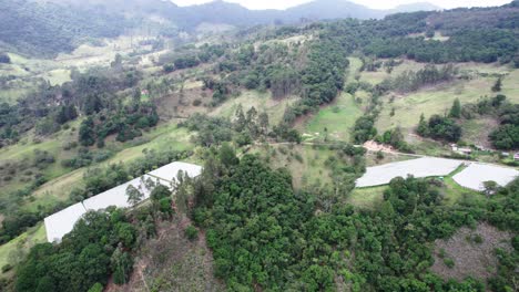 Rotating-drone-view-of-hills-with-wild-trees-and-plants