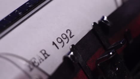 Year-1992,-Typing-on-Blank-White-Paper-in-Vintage-Typewriter,-Close-Up