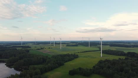 Wind-turbines-in-a-green-agricultural-field-producing-renewable-energy