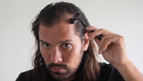 man-wearing-roller-hair-on-his-head-to-prevent-baldness,-DHT