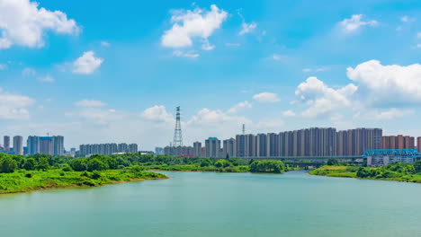 Modern-cityscape-High-rise-skyscraper-building-under-clear-blue-sky-time-with-windy-cloudy-weather