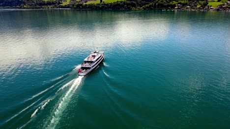 Aerial-take-of-the-Thunensee-lake-in-Swiss-alps,-nearby-Interlaken-town