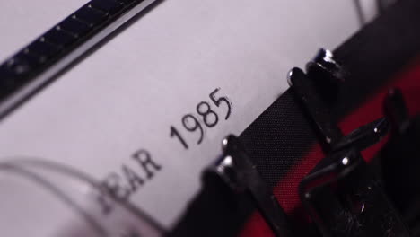 Year-1985,-Typing-on-Blank-White-Paper-in-Vintage-Typewriter,-Close-Up