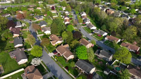 Aerial-flyover-upper-class-neighborhood-of-american-town-with-swimming-pool-in-yard