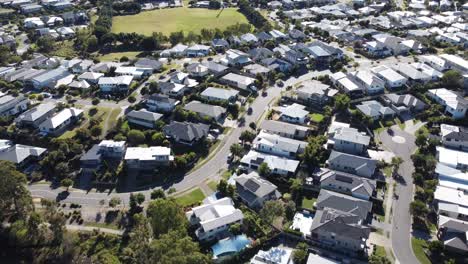 4K-Drone-footage-of-an-upmarket-Australian-neighbourhood-with-large-family-homes-and-a-sporting-field-in-the-background