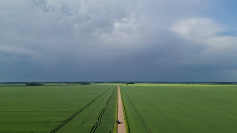 Rural-Road-In-Sweeping-Agricultural-Farmlands.-Timelapse