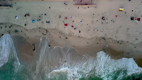 People-are-Delighting-in-the-Summer-Season-at-Mission-Beach,-San-Diego,-California,-USA---Aerial-Topdown-Shot