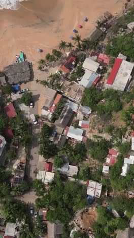 Mazunte-village,-Oaxaca,-vertical-drone-view