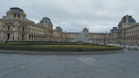 The-Louvre-museum-from-behind-a-roundabout-in-Paris