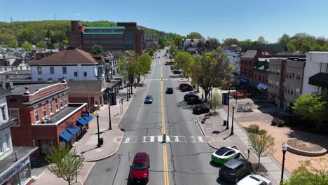 Driving-cars-on-main-street-of-small-historic-town