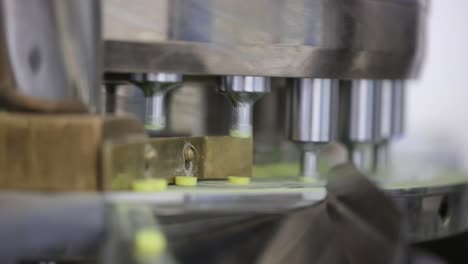 close-up-seen-tablets-poured-inside-the-machine-and-going-to-the-packaging-line