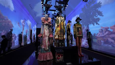 An-artistic-fashion-exhibition-showcasing-a-collection-of-unique-and-elaborate-clothing-designs-in-a-creatively-lit-gallery