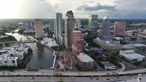 High-aerial-establishing-shot-of-Tampa,-Florida-skyline-during-sunset