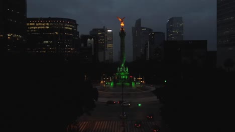 Mexico-City-Angel-of-Independence-intersection-at-night,-aerial-drone-El-Ángel