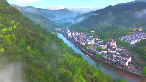 Aerial-photo-of-Tonglu-Mountain-Village-in-Hangzhou,-Zhejiang,-China,-surrounded-by-clouds-and-mist-in-the-early-morning，Beautiful-Countryside-in-China