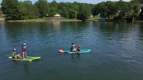 Family-Rides-Paddle-Boards-on-Calm-Lake-in-Pennsylvania