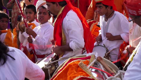 Hindu-men-and-boys-beat-drums-at-religious-festival