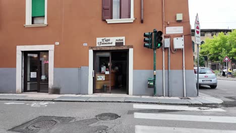 Verona-Italy-walking-the-streets,-with-small-shops,-hanging-flower-pots