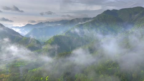 Aerial-photo-of-Tonglu-Mountain-Village-in-Hangzhou,-Zhejiang,-China,-surrounded-by-clouds-and-mist-in-the-early-morning