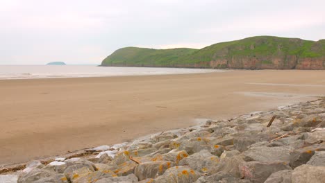 Shot-of-Brean-Beach-with-tides-approaching-seashore-in-England