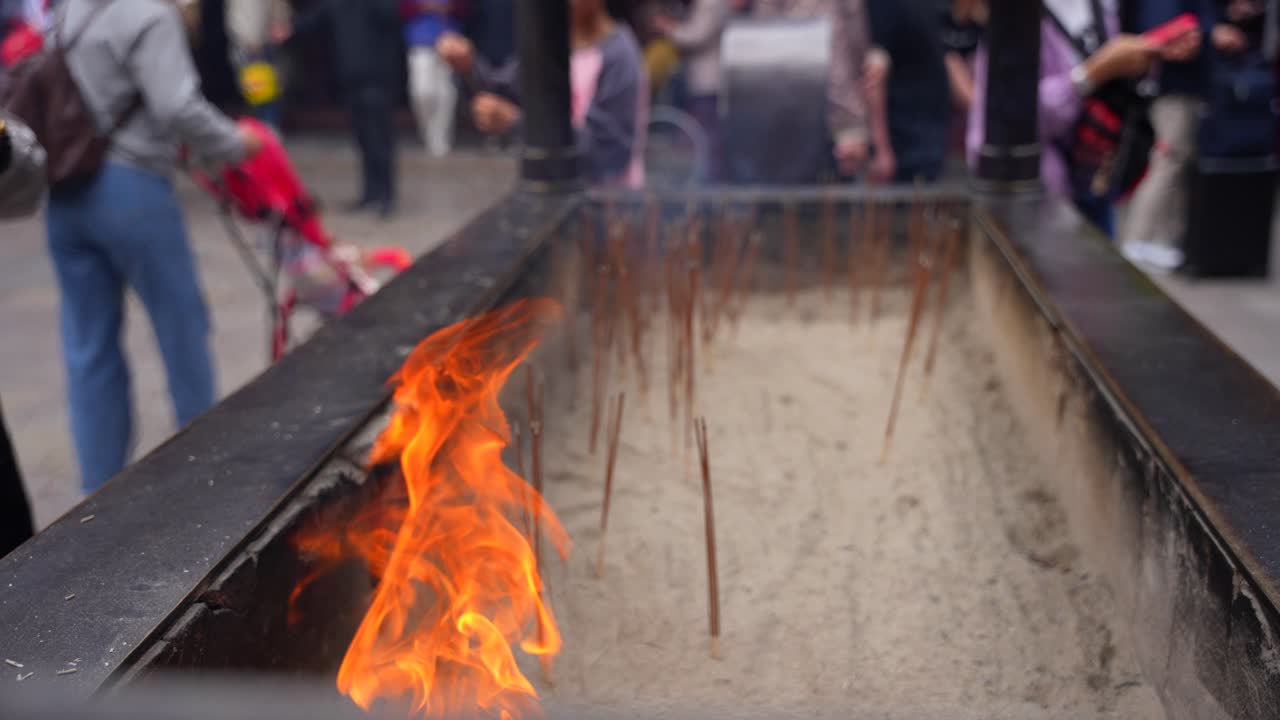 Chinese People Placing Sticks Of Incense In The Fire Free Stock Video ...