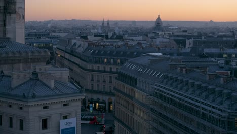 Top-view-of-Parisian-rooftops-at-sunset