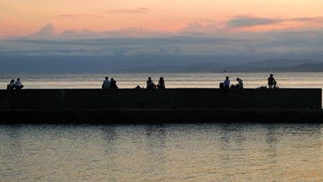 Calm-and-relaxing-scenery-at-silhouetted-wave-breaker-in-Japan-at-ocean